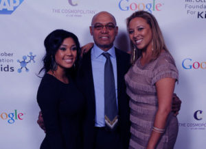 Image of Kimberly Jackson with father Reggie, and his Current partner at Mr. October Foundation for Kids Event