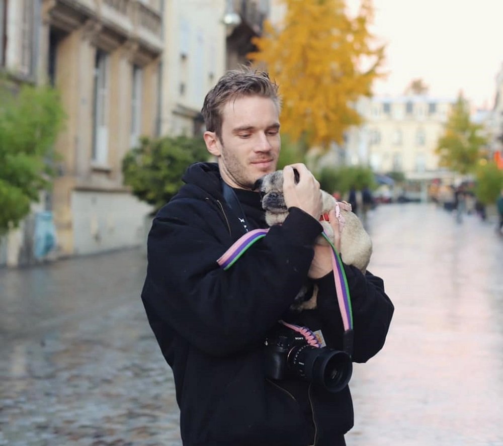 Image of Youtuber Pewdiepie with his dog.